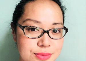 Author Maisie Chan smiling in a headshot photograph