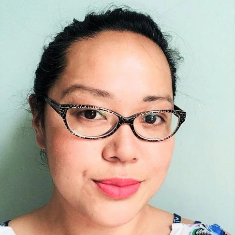 Author Maisie Chan smiling in a headshot photograph