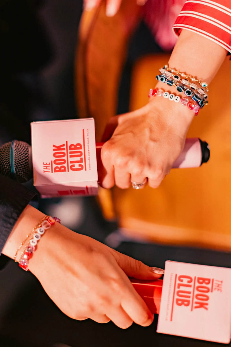 The Book Club Scotland Close-up of branded microphones used at a Book Club Scotland event.
