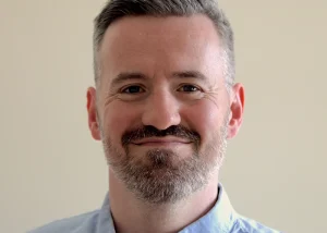 Portrait of children's author Gary Chudleigh smiling.