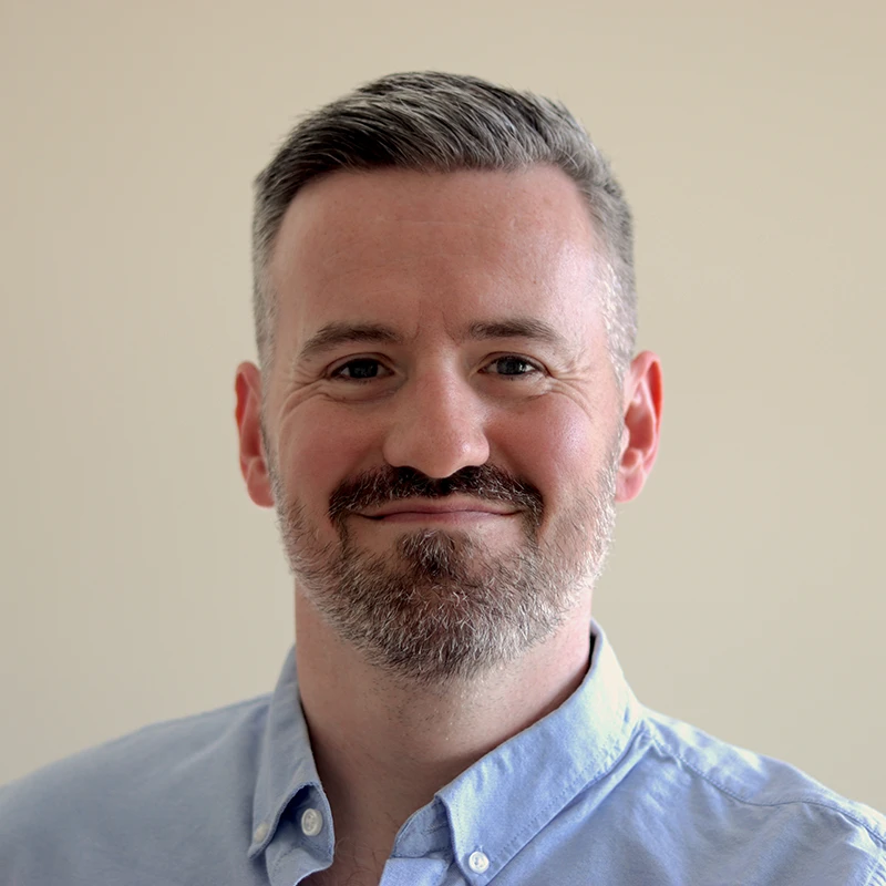 Portrait of children's author Gary Chudleigh smiling.
